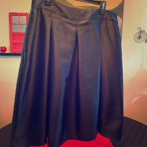 Black taffeta A-line skirt.